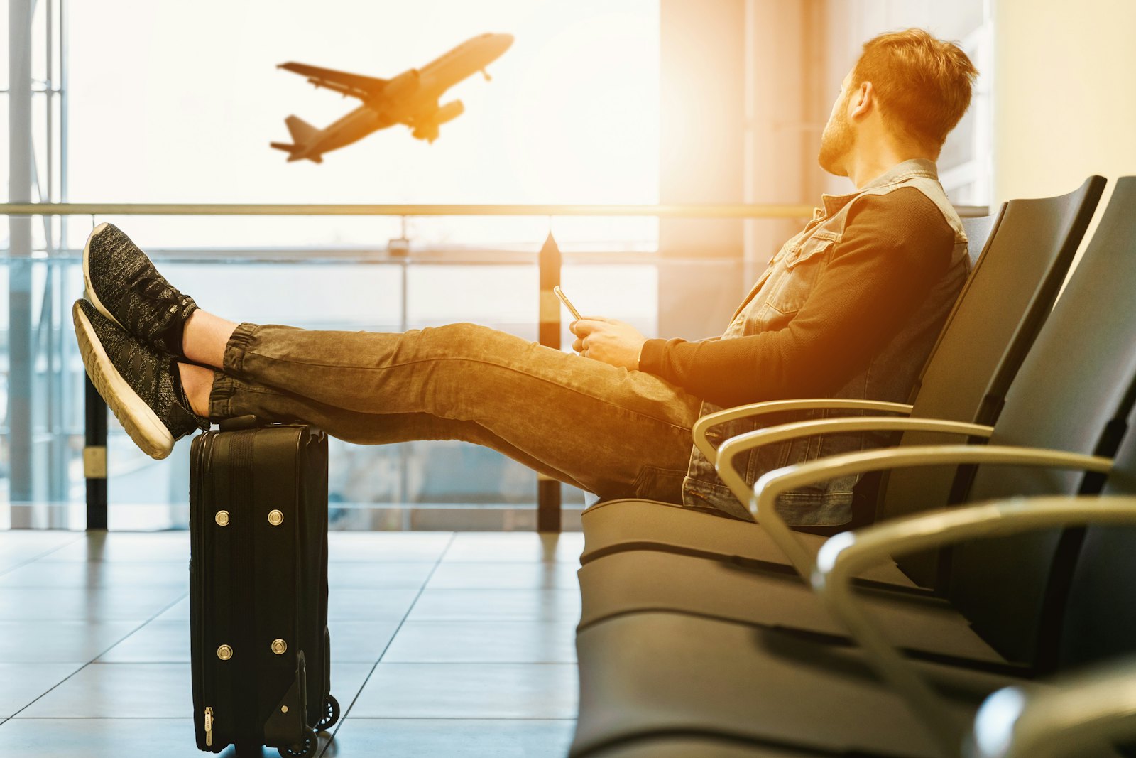 Traveller relaxing at an airport gate
